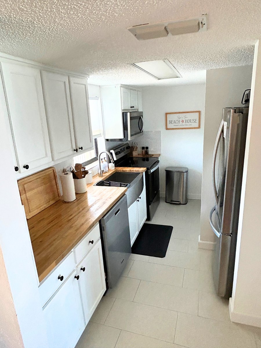 Updated kitchen is fully stocked with upgraded dishware, cookware, glasses, and utensils. 