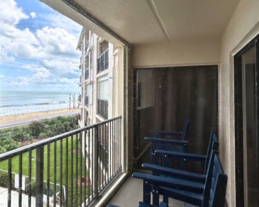 Balcony access from Bedroom 1, Bedroom 2 and the living room. Overlooks the pool and stunning beachfront views. Enjoy sunrises displaying a hundreds of shades of golds, blues, oranges, and greens. 
