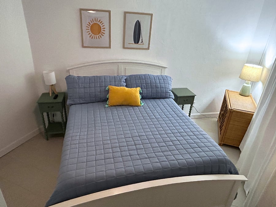 Bedroom 3 features a queen-sized bed, a roomy closet, a TV, and a ceiling fan. 