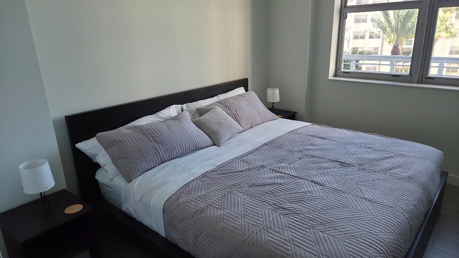 Recharge in comfort. This thoughtfully designed bedroom offers everything you need for a restful stay.