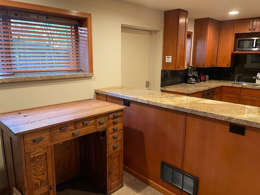 Entry door convenient to kitchen and workspace