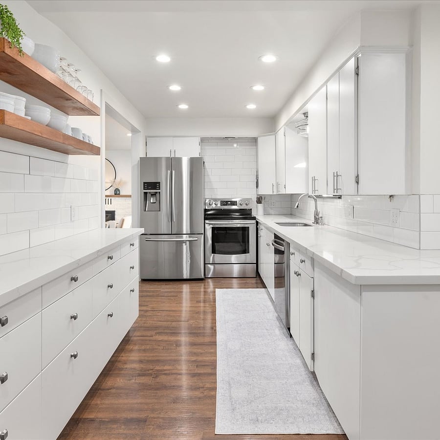 Prepare meals with ease in this fully equipped kitchen, featuring ample counter space and all the essentials.