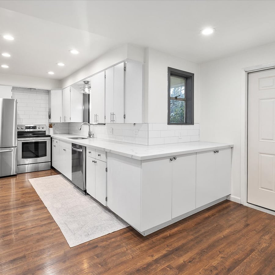 Prepare meals with ease in this fully equipped kitchen, featuring ample counter space and all the essentials.