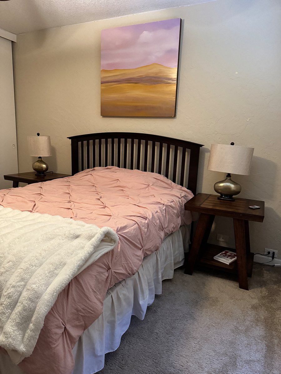 This is the one bedroom with a queen bed, two end tables and lamps a small dresser with another lamp that has USB boards for any type of device. A very large closet with hangers and different organizer, hangers for shoes or clothing with all of the bedding and sheets And pillows that you need. This is upstairs on the second floor and the bathroom is next to it along with a laundry room.