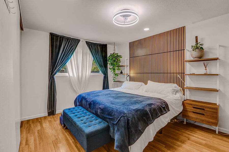 Main Bedroom with private bathroom. King size bed and blackout curtains.
