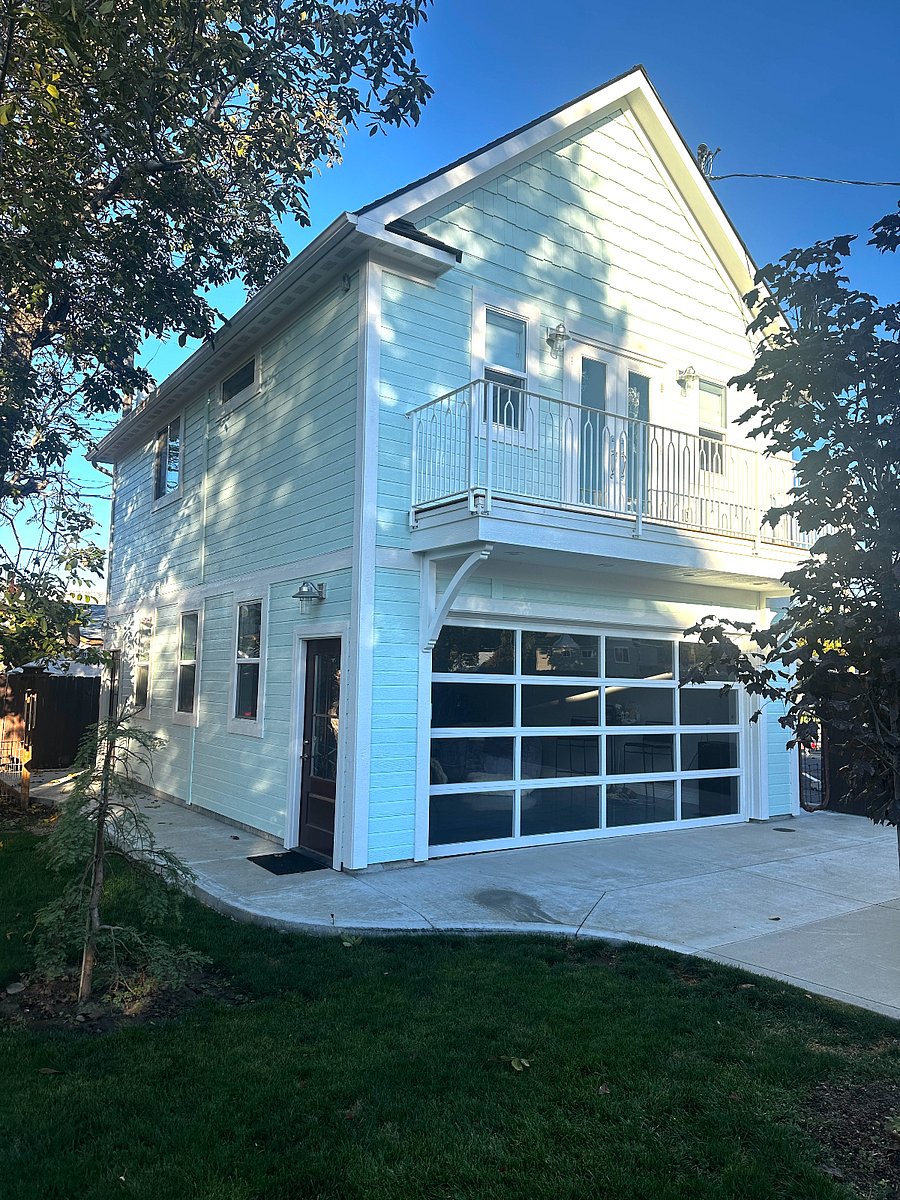 Loft with private balcony over newly constructed garage overlooking backyard.