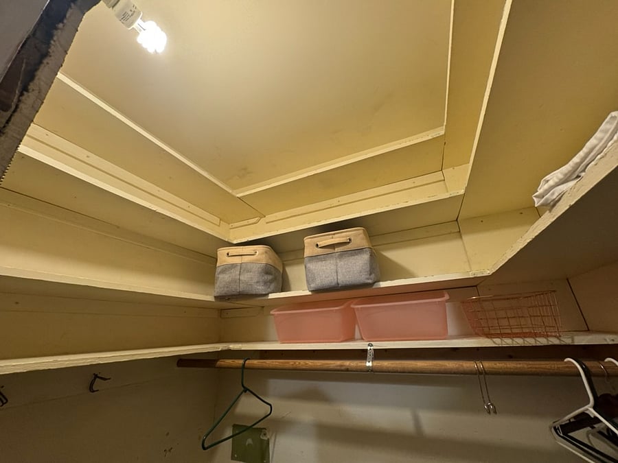 Main floor bedroom storage up to ceiling.