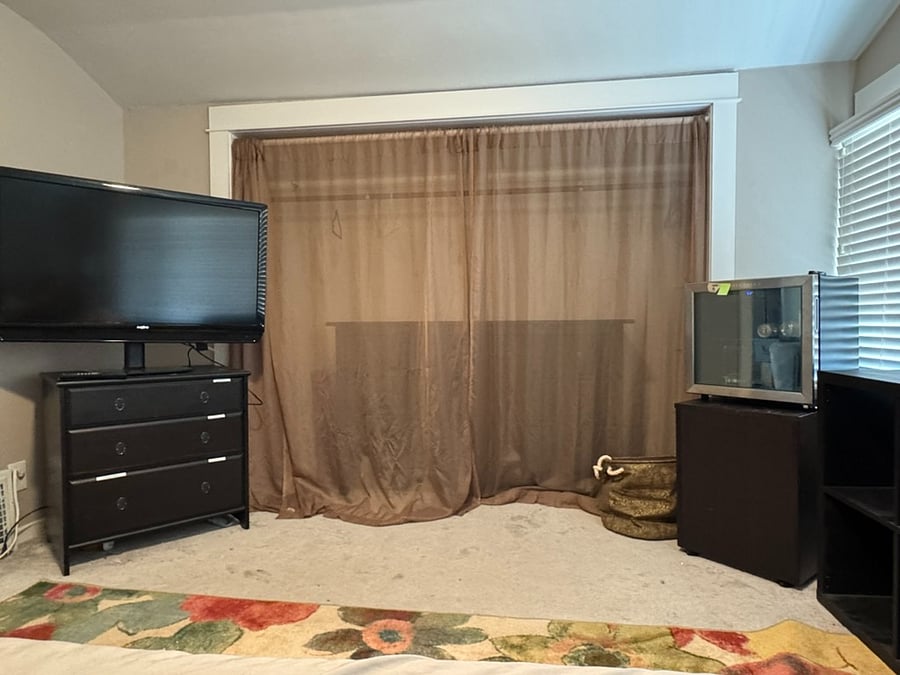 2nd floor master, view from bed. Drink fridge available amenity