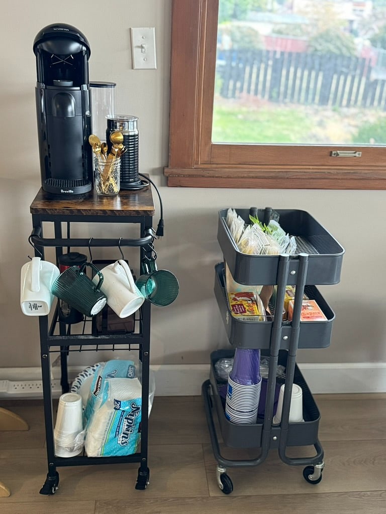 Complementary Nespresso latte machine complete with aerator, french press, grinder and tea cart.