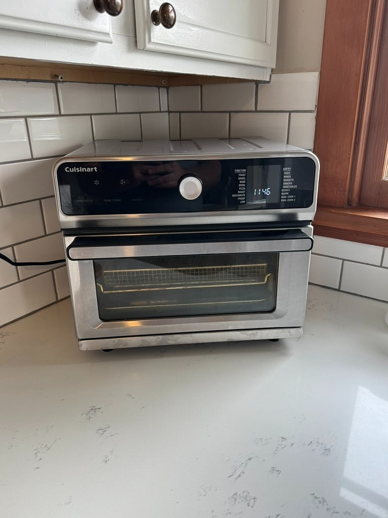 The large-capacity 10-in-1 Cuisinart Air Fryer complementary amenity: This versatile countertop oven has multiple cooking functions, including Air Fry, Bake, Broil, Roast, Toast, and Warm, Dehydrate and Proof.