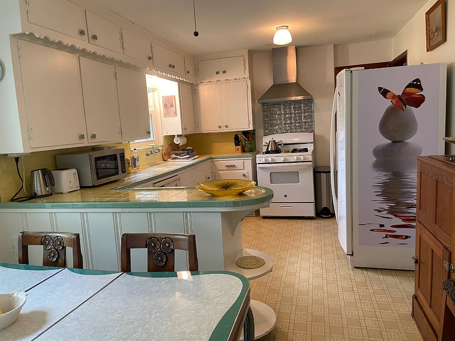Full kitchen view from dining area.