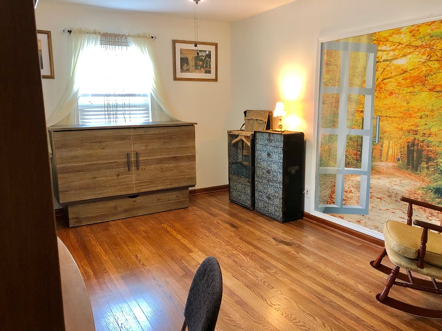 Yellow bedroom. Bed can fold away into cabinet.