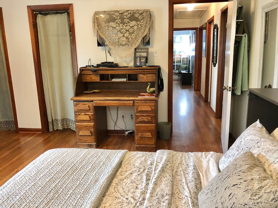 Green bedroom. Full desk and TV.