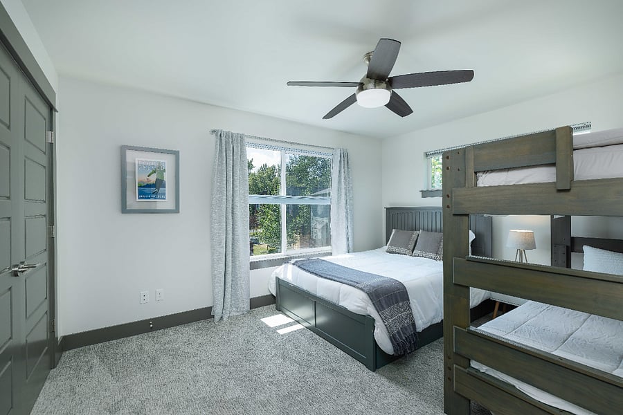 Third bedroom on second floor with queen bed and double twin bunk bed.
