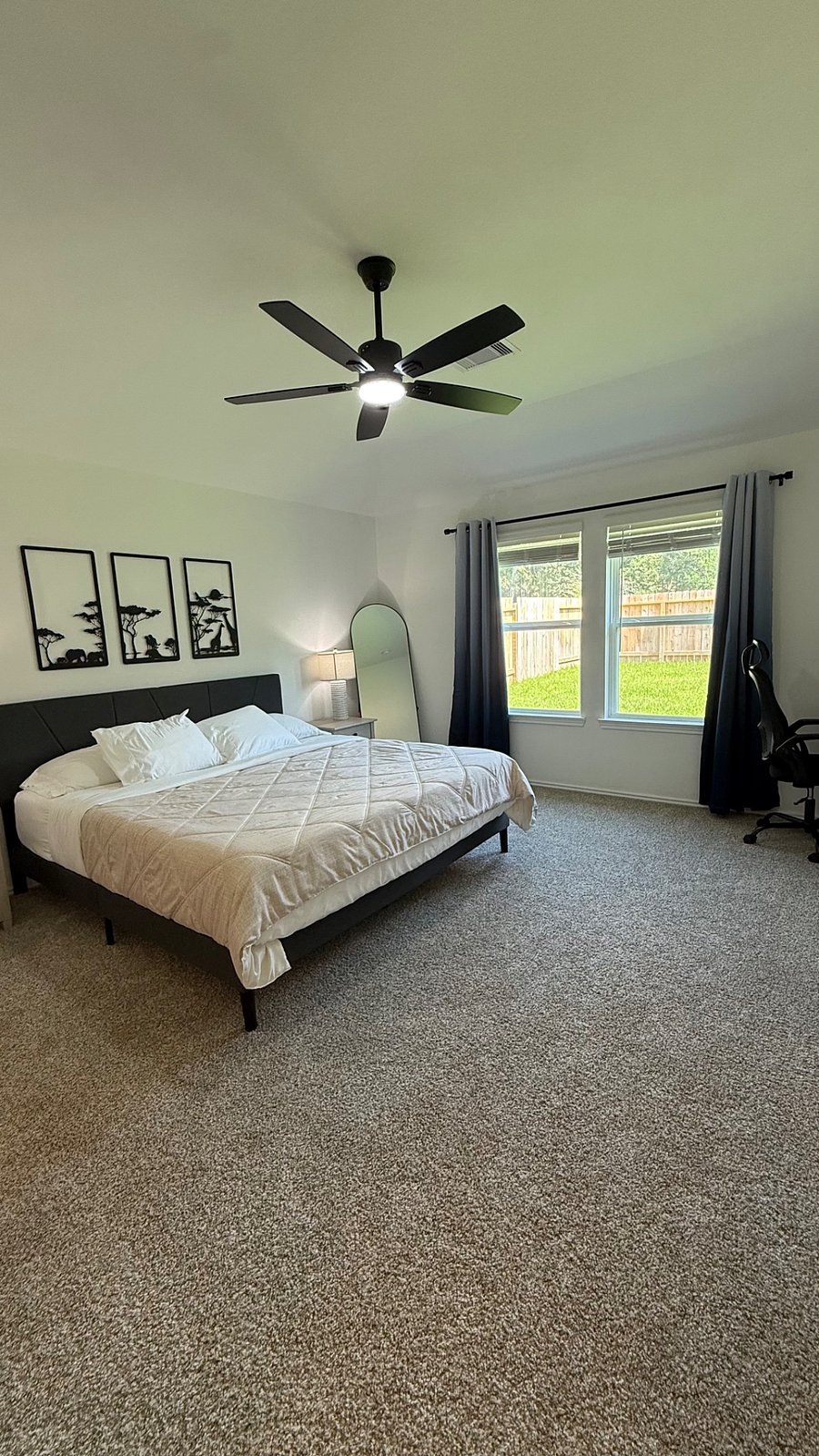 Master bedroom, king size bed with a dedicated work space.
