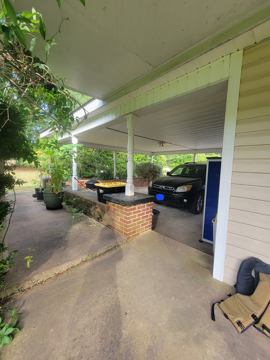 View from backdoor into the 2 car carport.