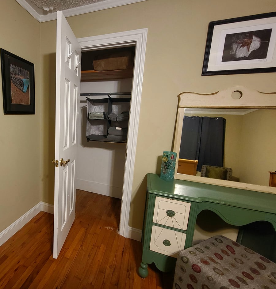 Vanity and closet. There are towels and an extra blanket in the closet and the Vanity has 4 drawers.