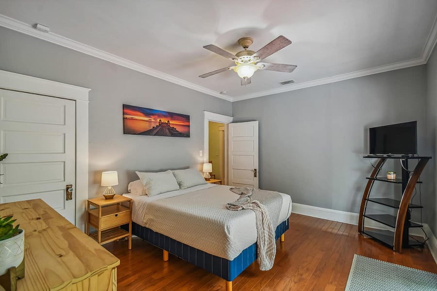 Primary bedroom includes a closet and Roku-equipped TV