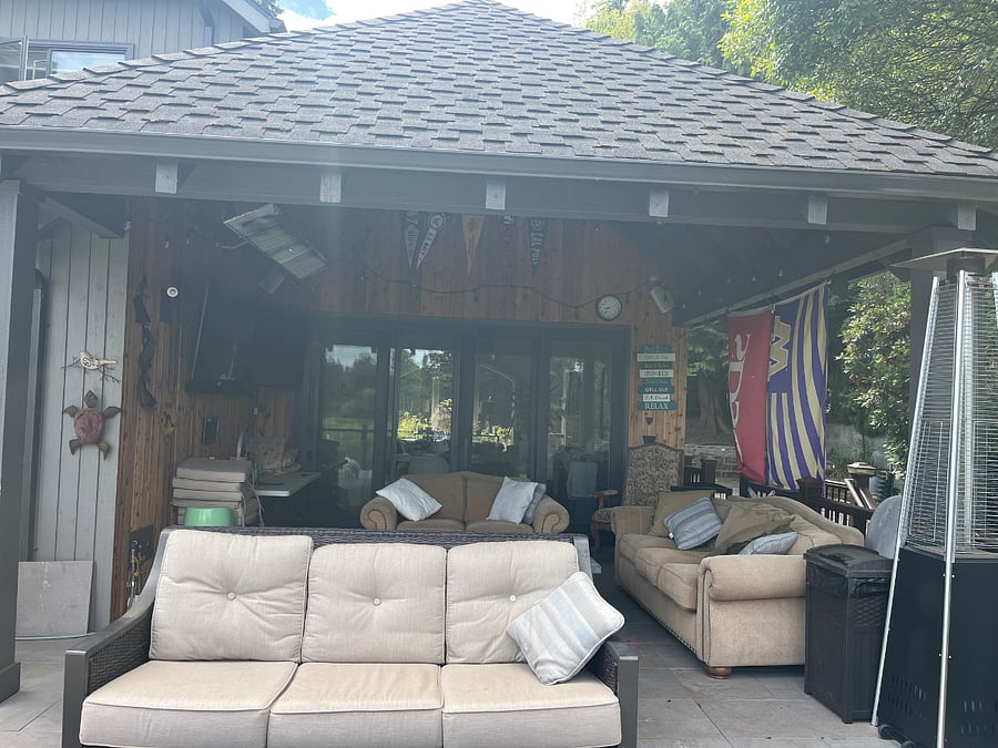 Covered porch with two TVs