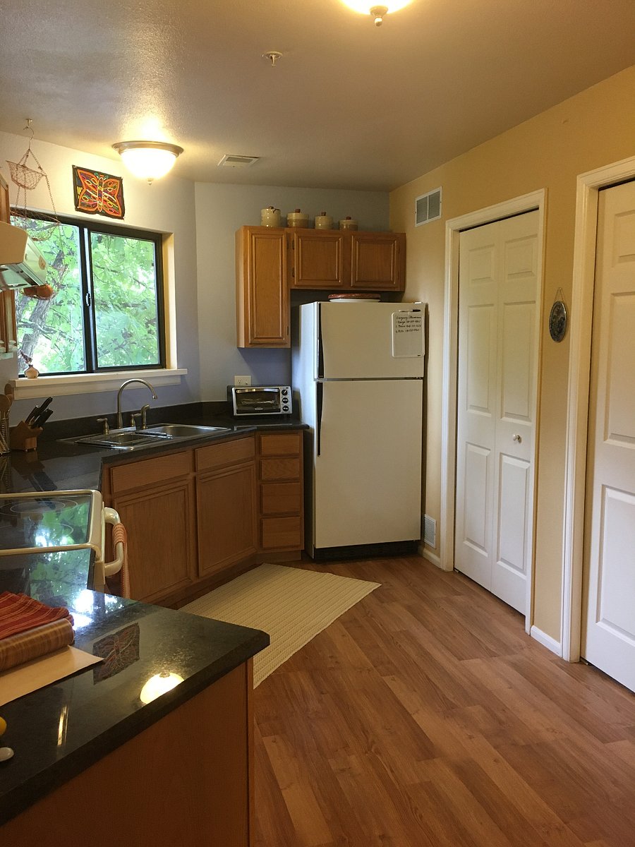 Kitchen with a closet and a laundry space