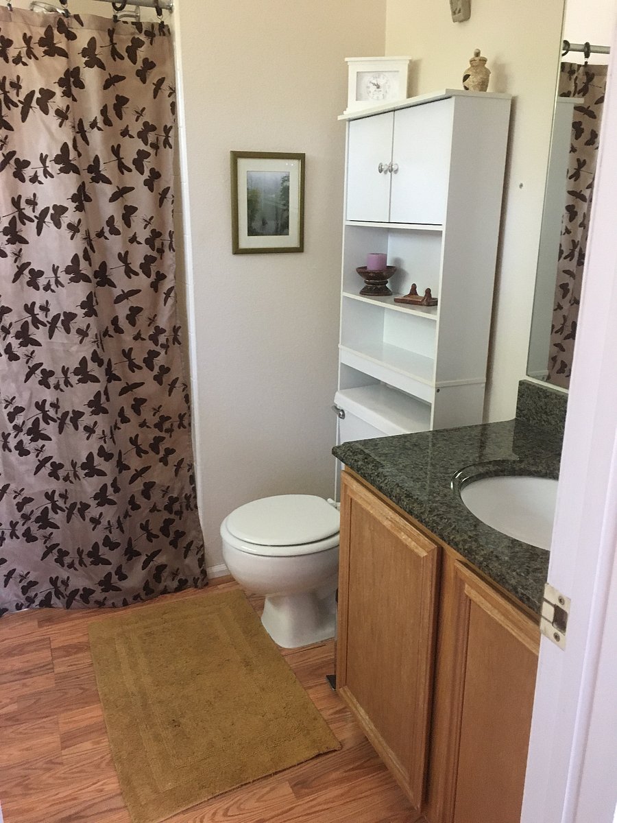 Bathroom adjacent to the larger bedroom