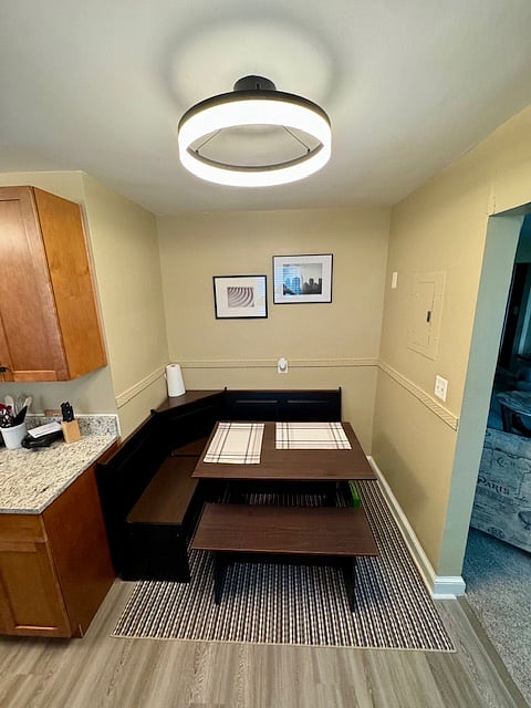 The kitchen features a breakfast nook table for cozy meals. 