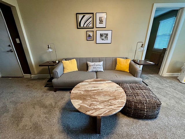 Sofa, sofa table, and ottoman. 