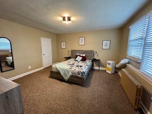 Large master bedroom comes with a queen-sized bed and memory foam mattress, as well as a dresser and mirror and a walk-in closet. 