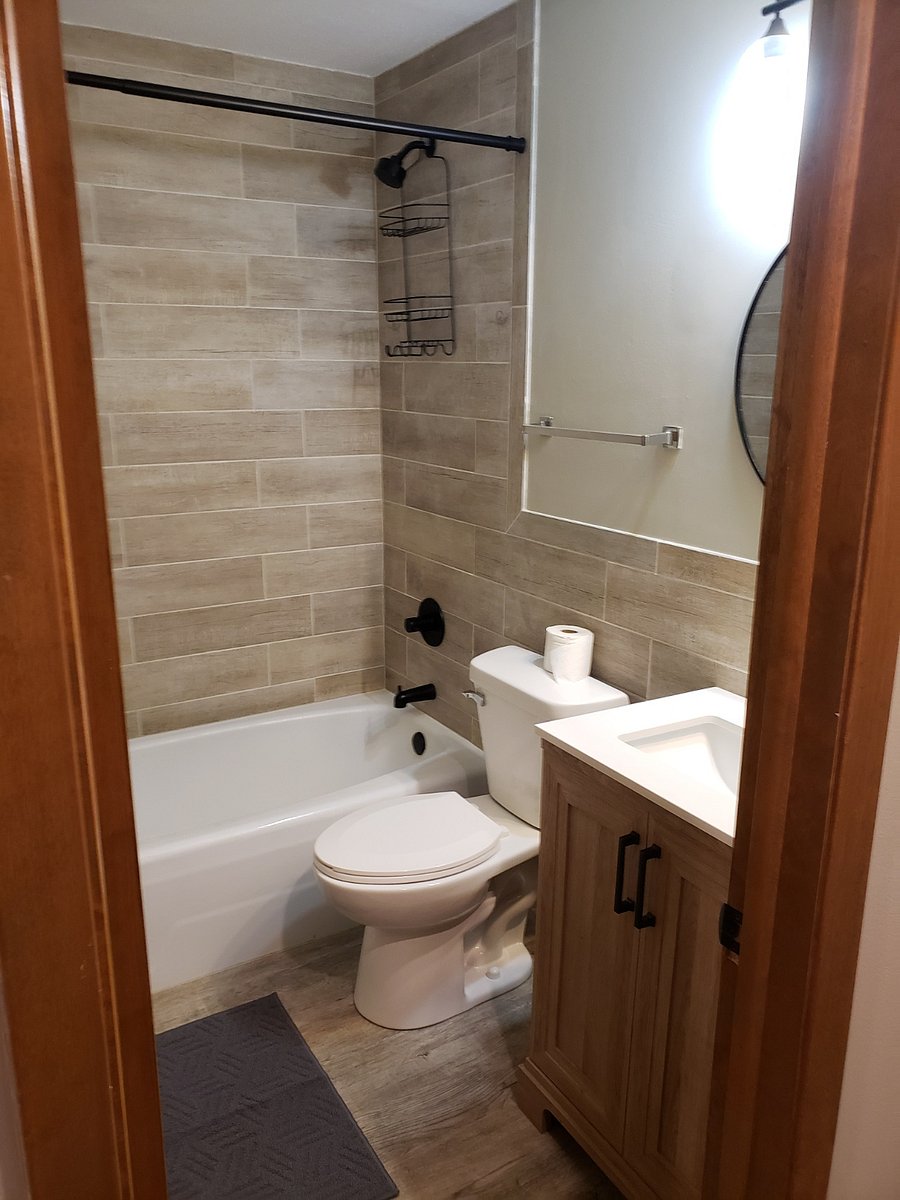 Full bath with completely tiled shower.