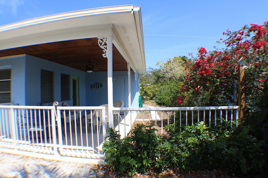 Tropical Landscape throughout the property and fully fenced which includes the entry pato.
