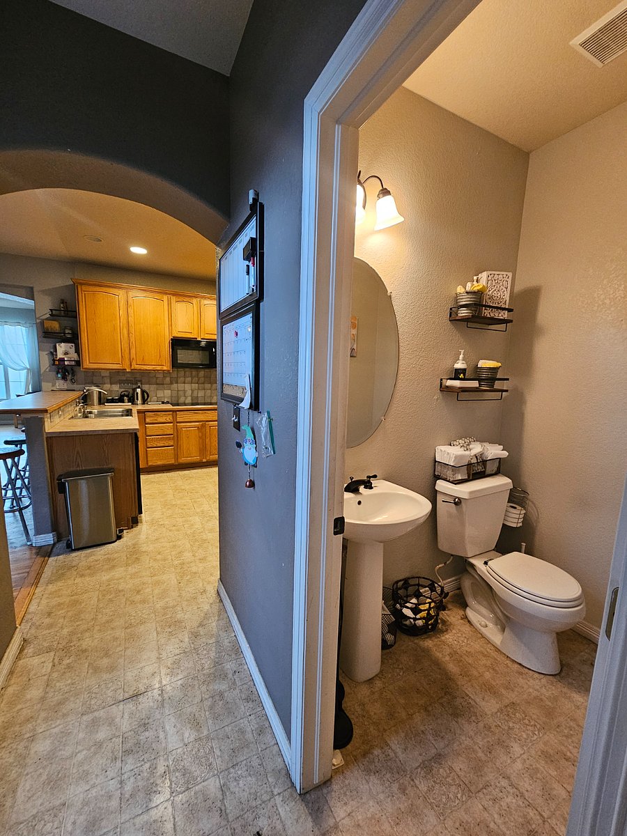 Kitchen & powder bathroom off of kitchen, near laundry room