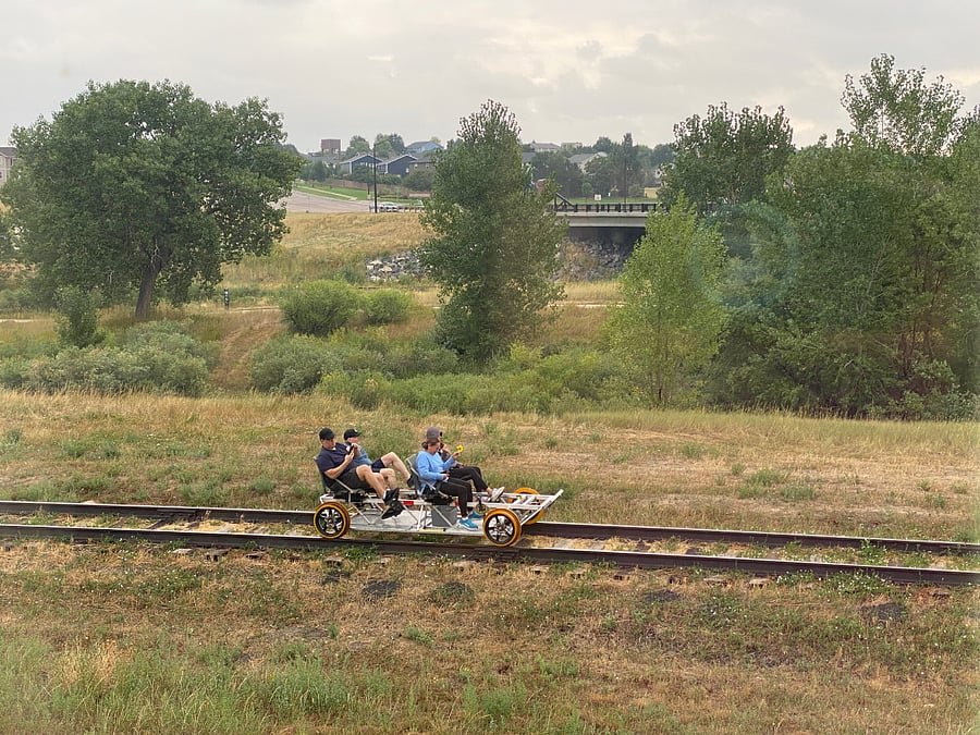 The decommissioned train tracks behind the home are used for rail bikes.