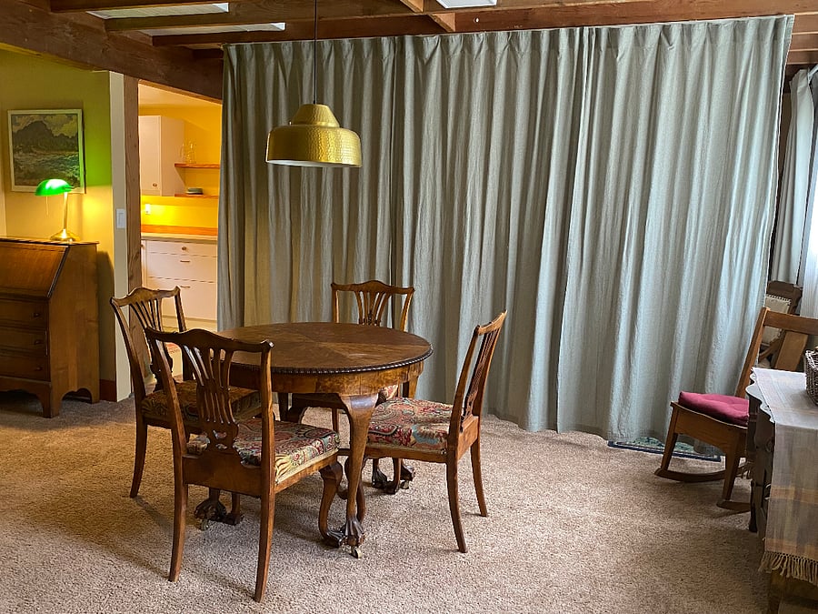 Hide the "bedroom" with track curtains.