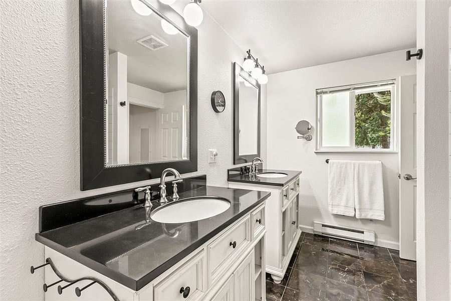 Jack and Jill bathroom has plenty of room for all your toiletries. The recently recoated cast iron bathtub makes a great place to soak after a long day.at work.