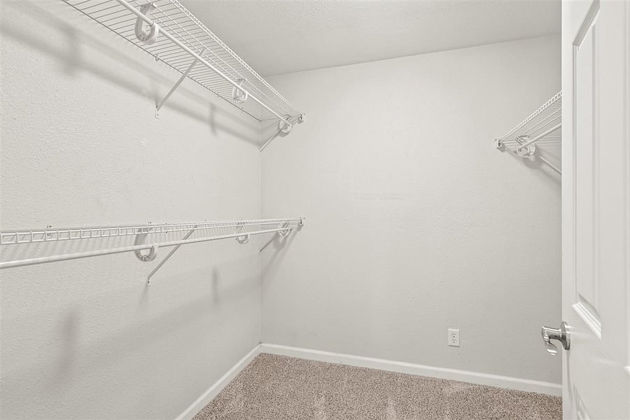 Extra large walk in closet will hold all your clothes and shoes!
