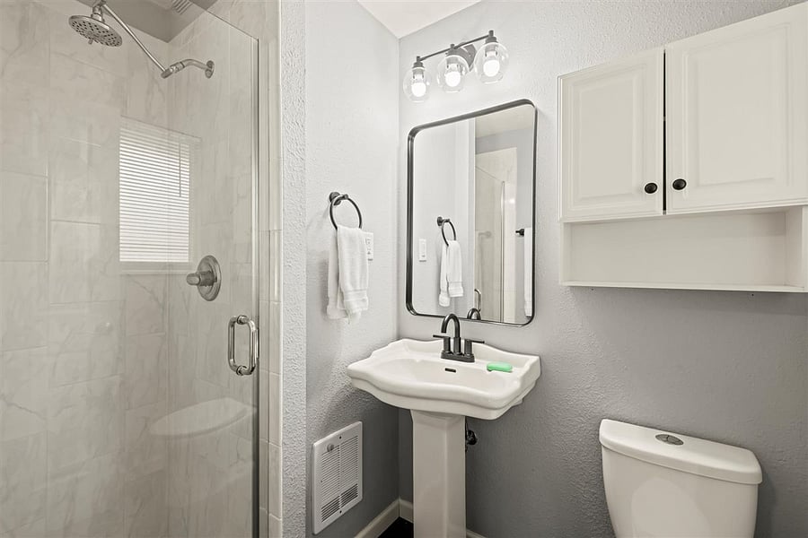 Bathroom has new faucet and towel bars.