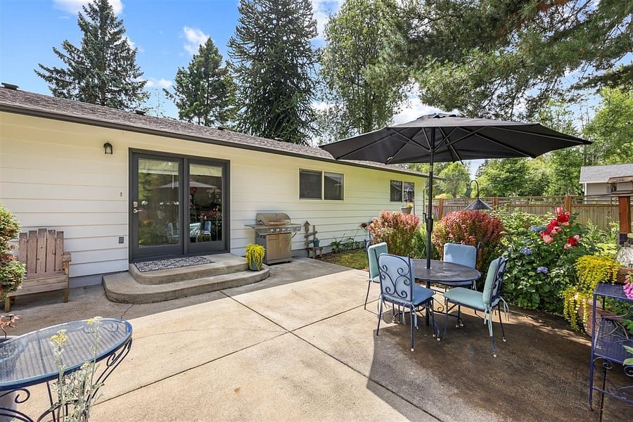 Double Adirondack chairs w/table are great to kick back and relax.
Umbrella table has 4 chairs.
Grill is currently out of commission.