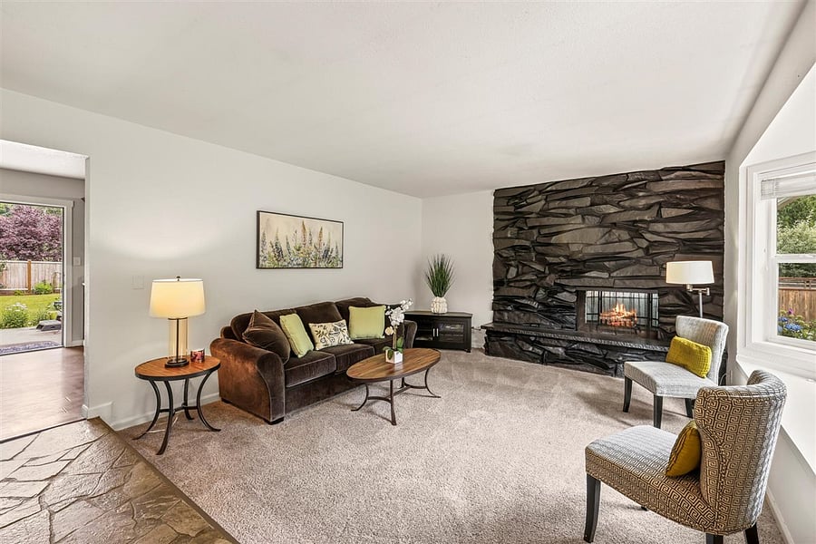 Comfortable step down living room. Fireplace is for looks only. Heat source is electric heaters.