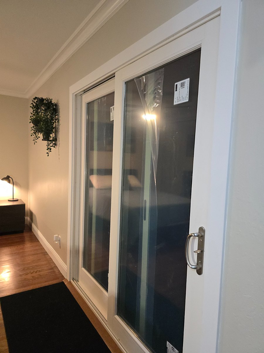Brand new sliding door leading to private back yard- sliding door has lock key capability for added security.