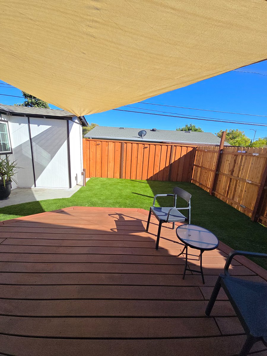 Day time view of private backyard, perfect for enjoying California sun with some shade.