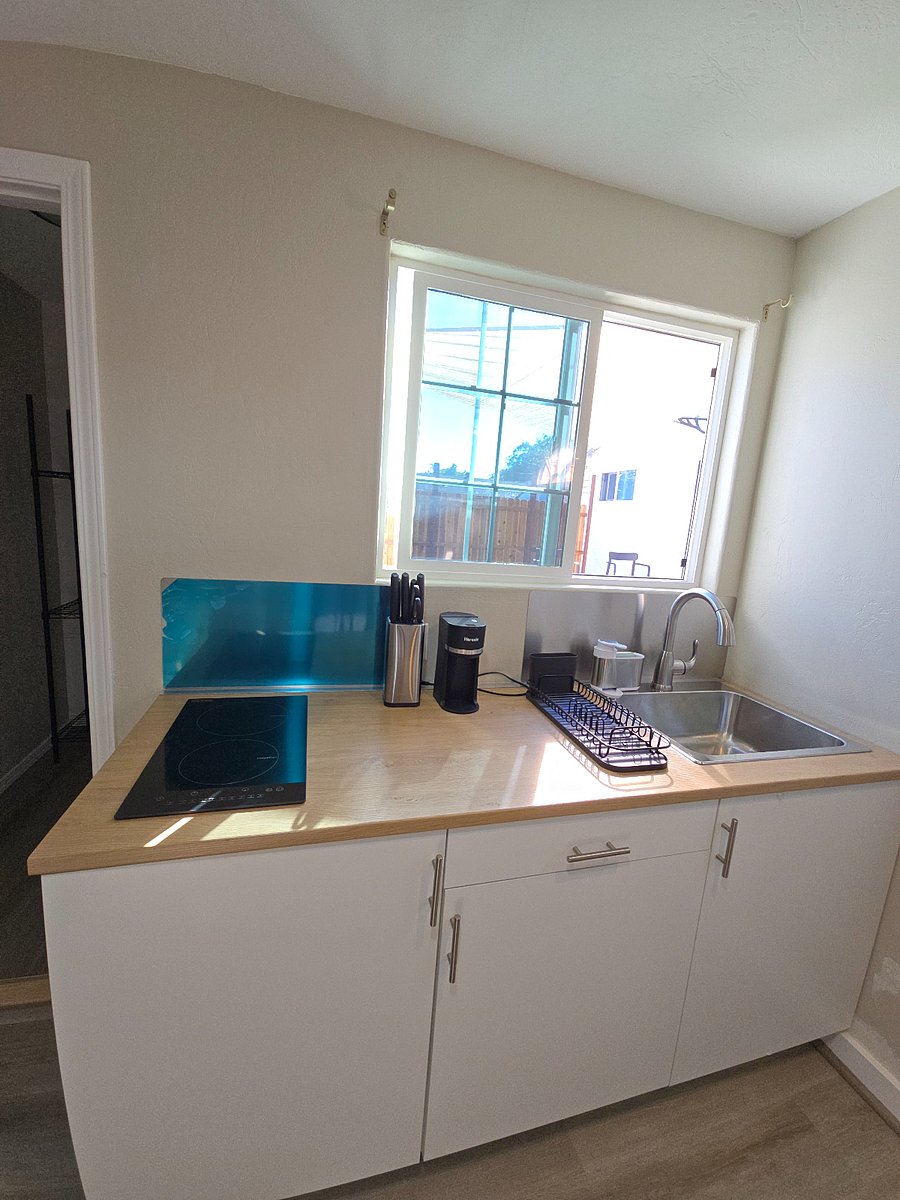 Full private kitchen- full sink, coffee maker (K-pods and for coffee grounds), full knife set, induction stove top.