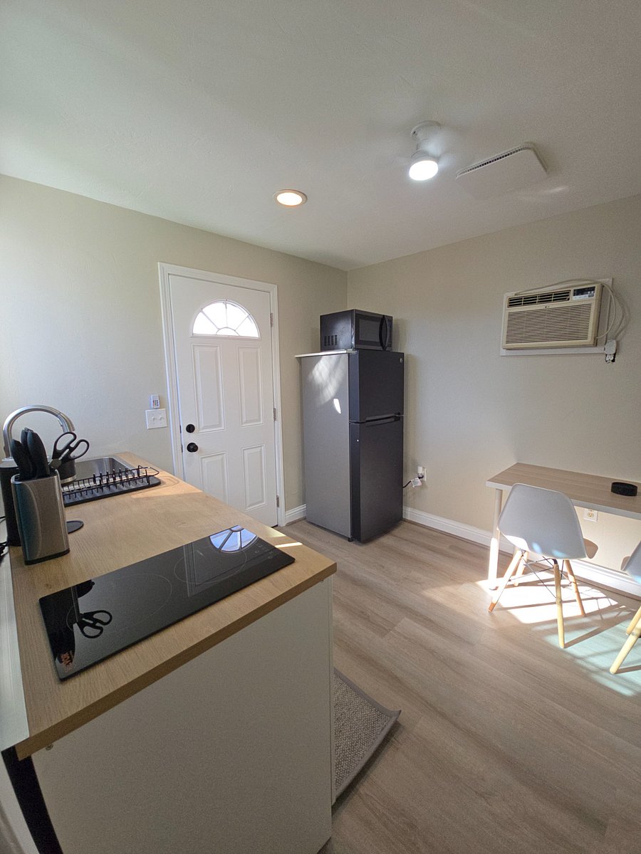 Full kitchen, dining table for two, full refridgerator, microwave, AC unit
