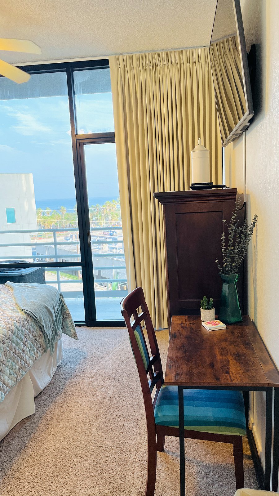 Guest Bedroom with a Queen Bed, plus Desk and TV, are in this room.
