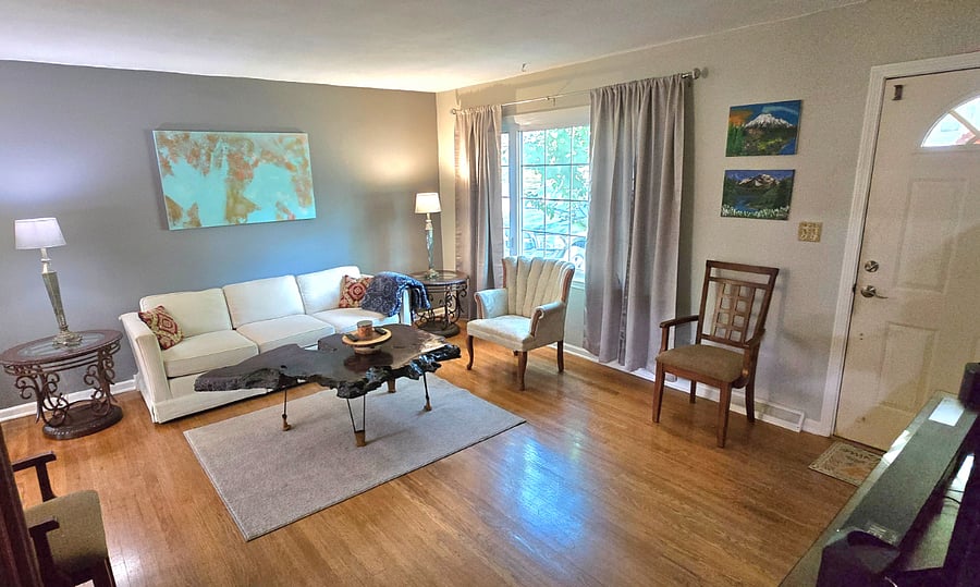 Open layout with living room visible from kitchen and dining area.