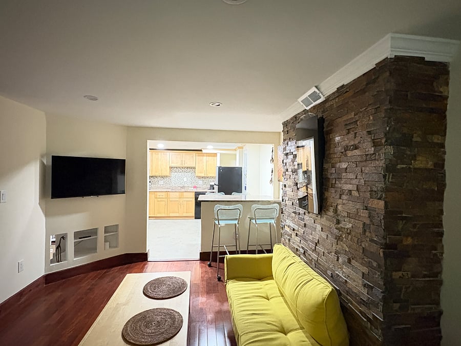 Separate living and kitchen with connecting peninsula