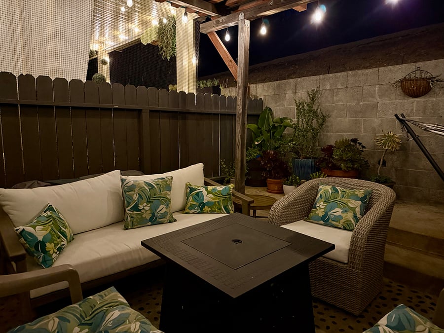 Private back patio with firepit, hammock, and dining table