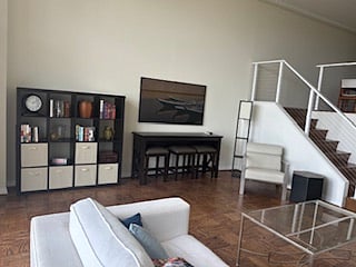 Living room (with view of stairs and dining area)