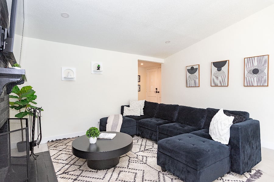 Bright living room with sectional sofa, comfortable for monthly stays
