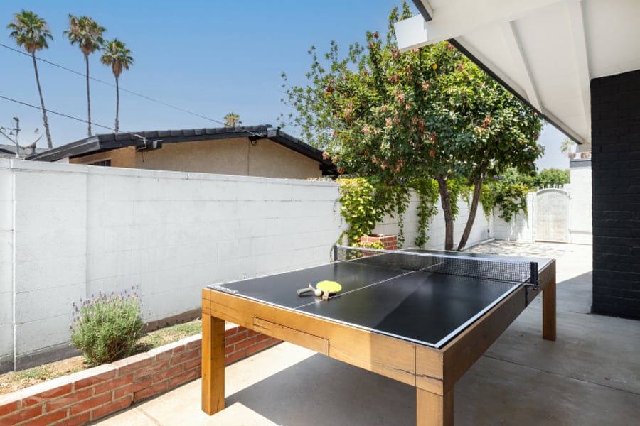 Outdoor ping-pong table in private backyard