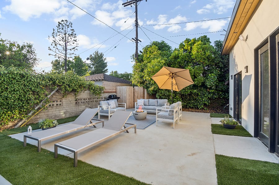 Private patio with sun loungers for comfortable 30+ day stays